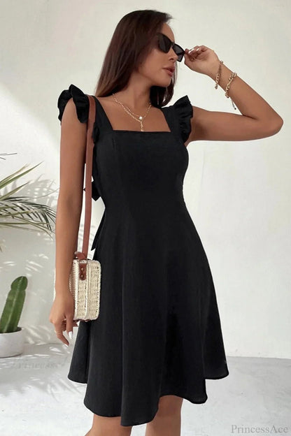 Carmen mini robe sans manches avec nœud volanté au dos