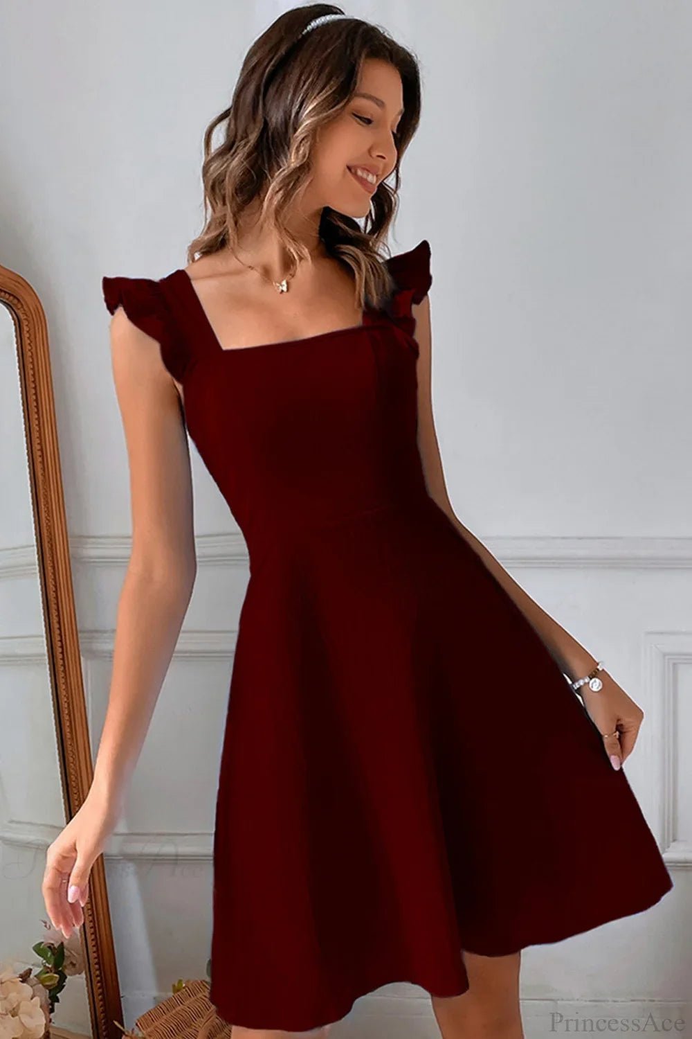 Carmen mini robe sans manches avec nœud volanté au dos