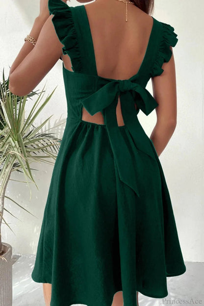 Carmen mini robe sans manches avec nœud volanté au dos