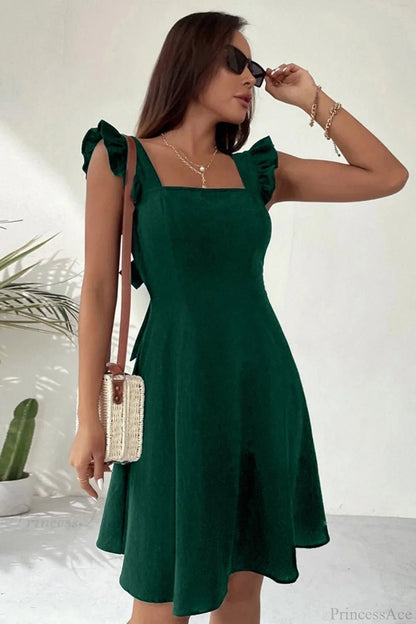 Carmen mini robe sans manches avec nœud volanté au dos
